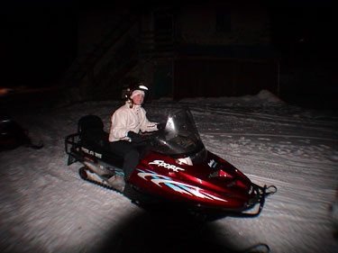 Caroline riding the skidoo